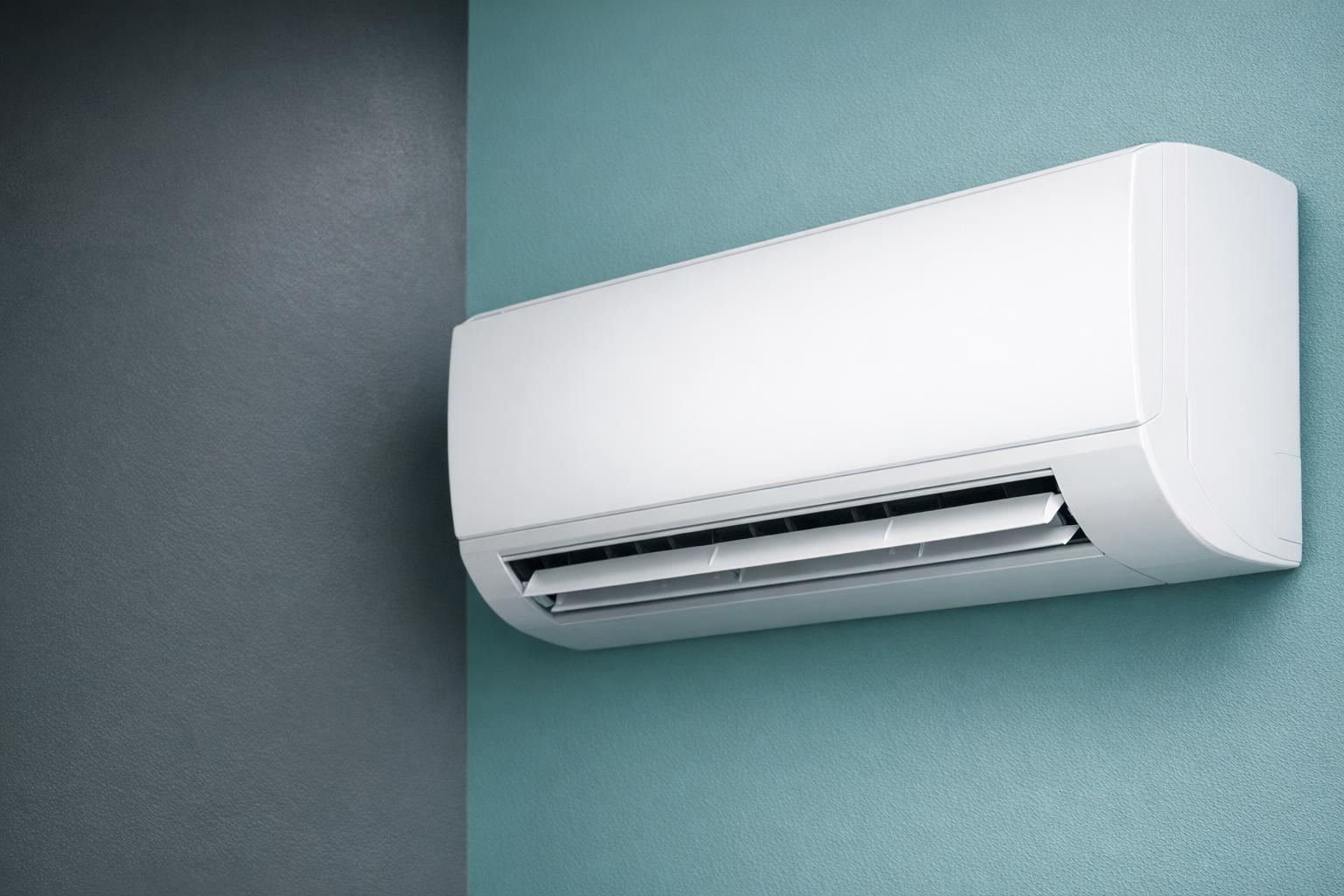 Close-up of a white wall-mounted air conditioner.